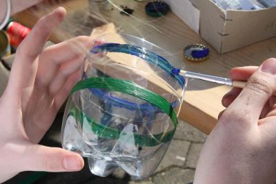 Painting a plastic water bottle
